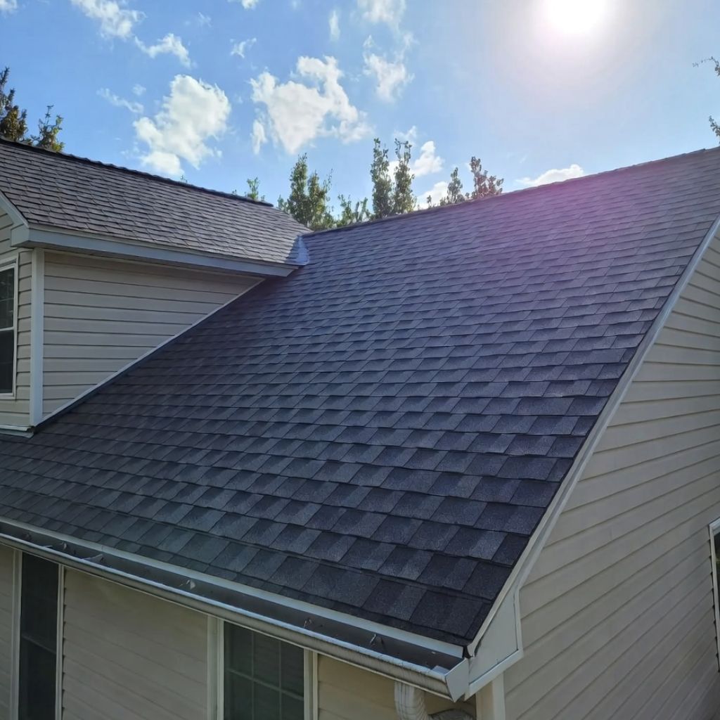 Professional roofer working on roof restoration in Michigan